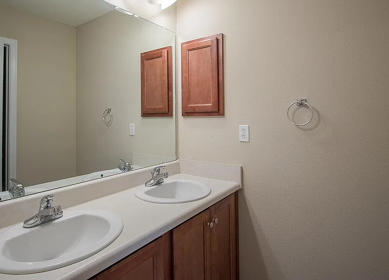 Primary bath #2 offers double sinks and shower/tub combo