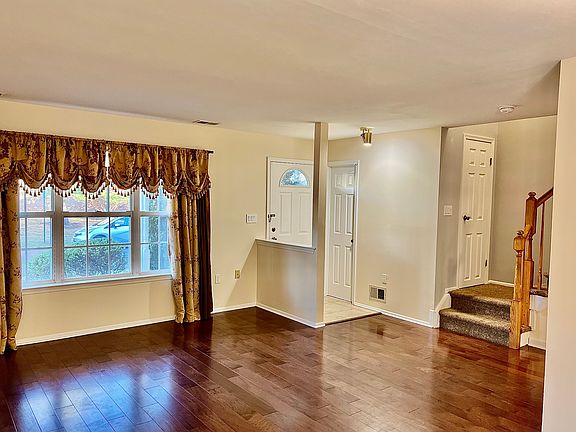 Open concept formal living room, featuring newly installed hardwood floors