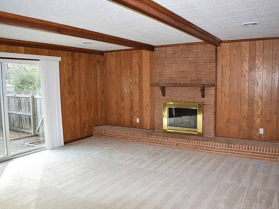 Large den with adjoining private patio