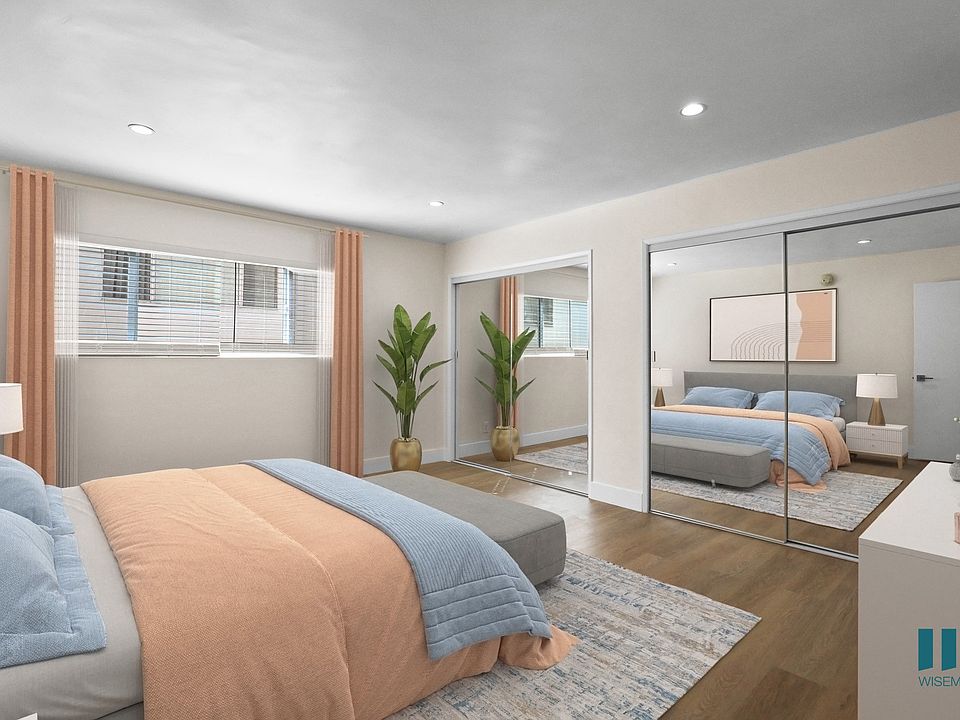 Bedroom with Two-Mirrored Closets, Vinyl Flooring, and Recessed Lighting