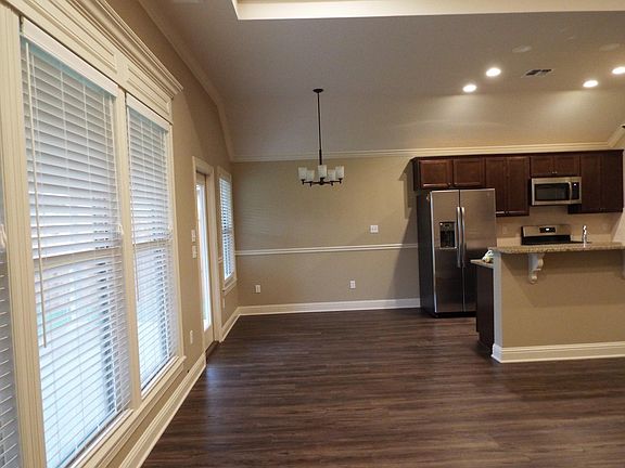 Living room flows into dining room and kitchen