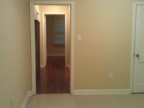 Kitchen and hall to 2 beds and hall bath