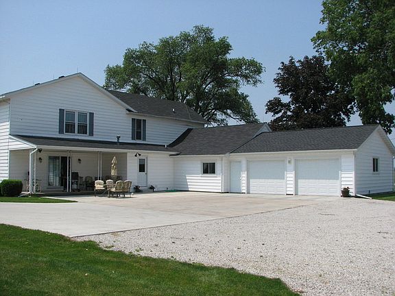Back of House
						:
						Concrete patio with 2 car garage.