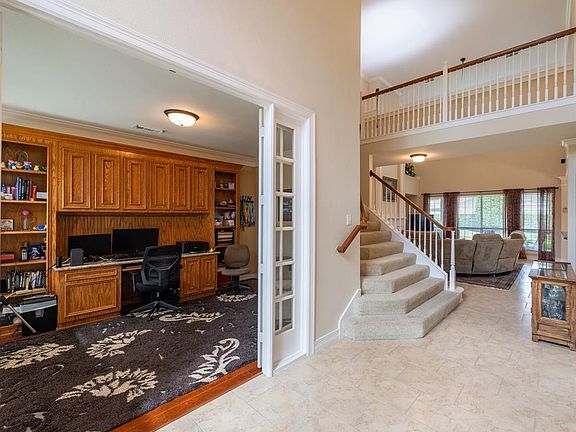 Off-set tile floors welcome you into this home and usher you past the study and formal dining room towards the open family room and kitchen area.