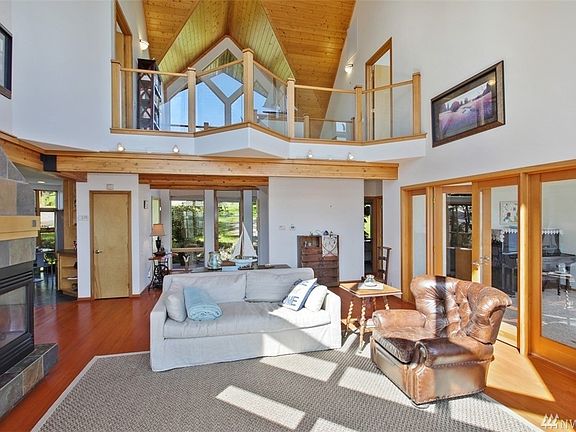 Vaulted ceilings and a cozy fireplace are a brilliant combination of light, yet cozy