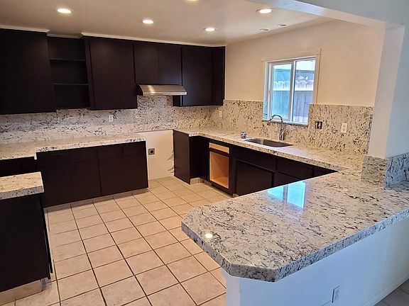 Kitchen: Peninsula Serves Dining Room
