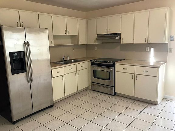 Kitchen with stainless steel appliances and area for dine-in