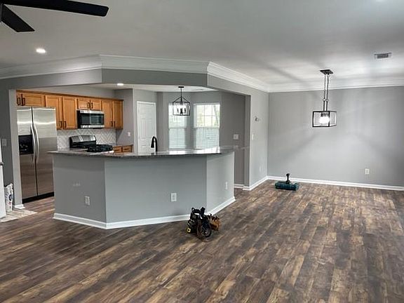 Open concept kitchen, dining, living room.