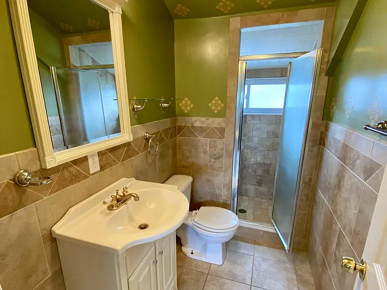 Tiled full bathroom on 3rd floor.