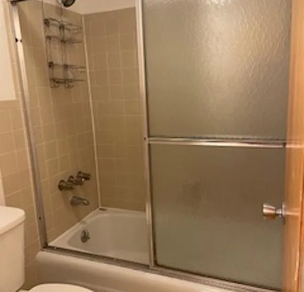 Main bath. This room has a door for privacy which separates this area from the sink and vanity.
