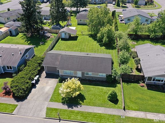 Aerial view of home shows the large fully fenced yard.