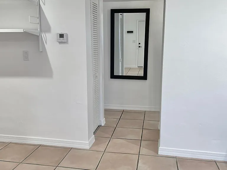Closets flank hallway