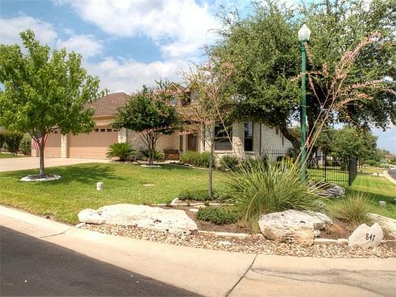 Corner Lot.  Three car garage.  Professional Landscaping.  Street Light.  Fenced back yard.