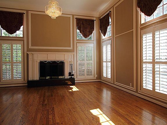 Living room with one of three fireplaces.