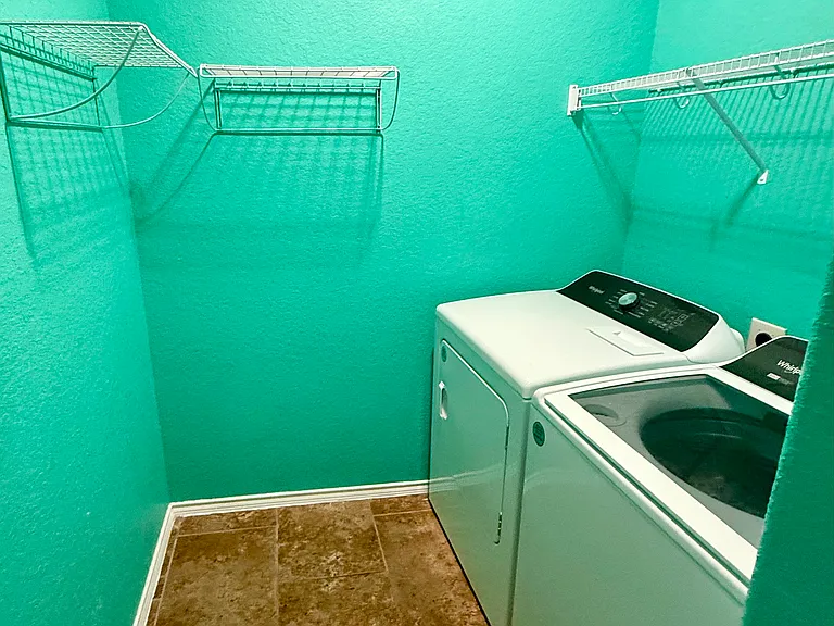 This laundry room will take you to Cabo San Lucas when your folding your beach towels