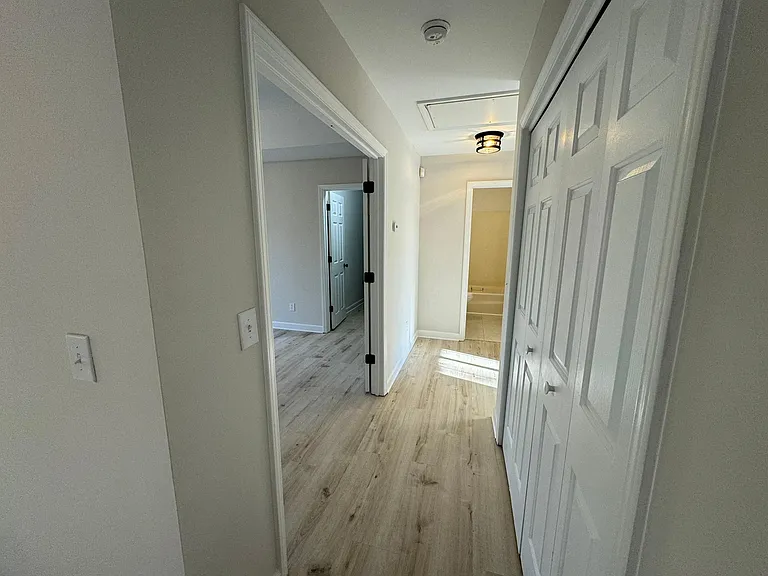 Hallway with laundry on right