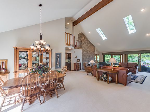 Perfection plus. An open floor plan, vaulted ceilings, skylights and amazing views make this main fl