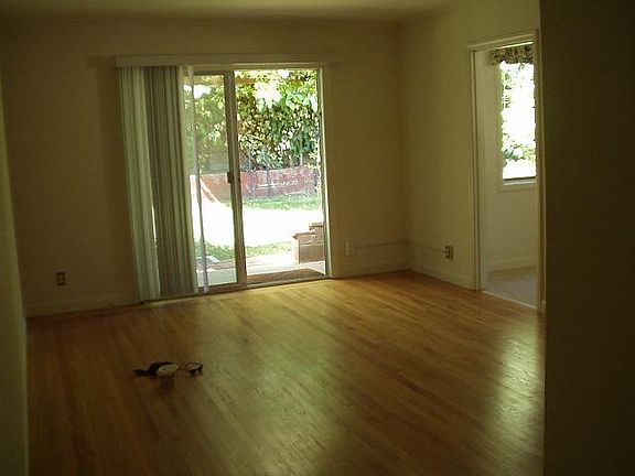 More living room toward back door and kitchen