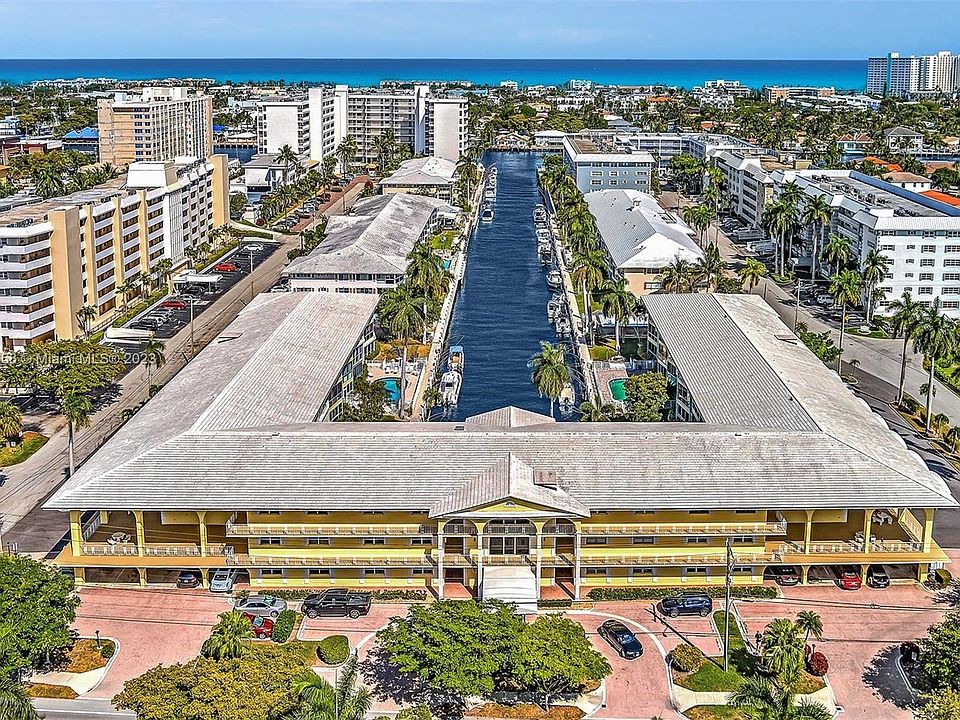 The Florida Room features floor to celling windows, is wide and brings light to the unit, Enjoy the breeze from the canal.