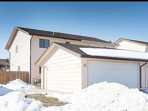 Front of house. 2 car garage