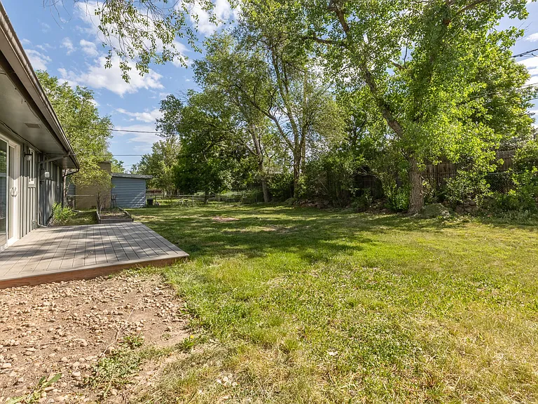 Back yard - fully enclosed with a deck.