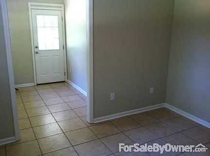 Laundry Room, look into small mud room
						:
						khaki color walls (color on ad not real)