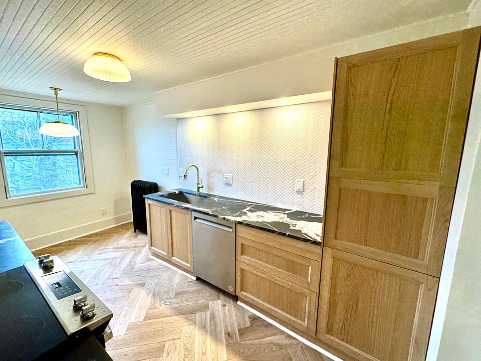 Kitchen with dishwasher, garbage disposal, and built in fridge.