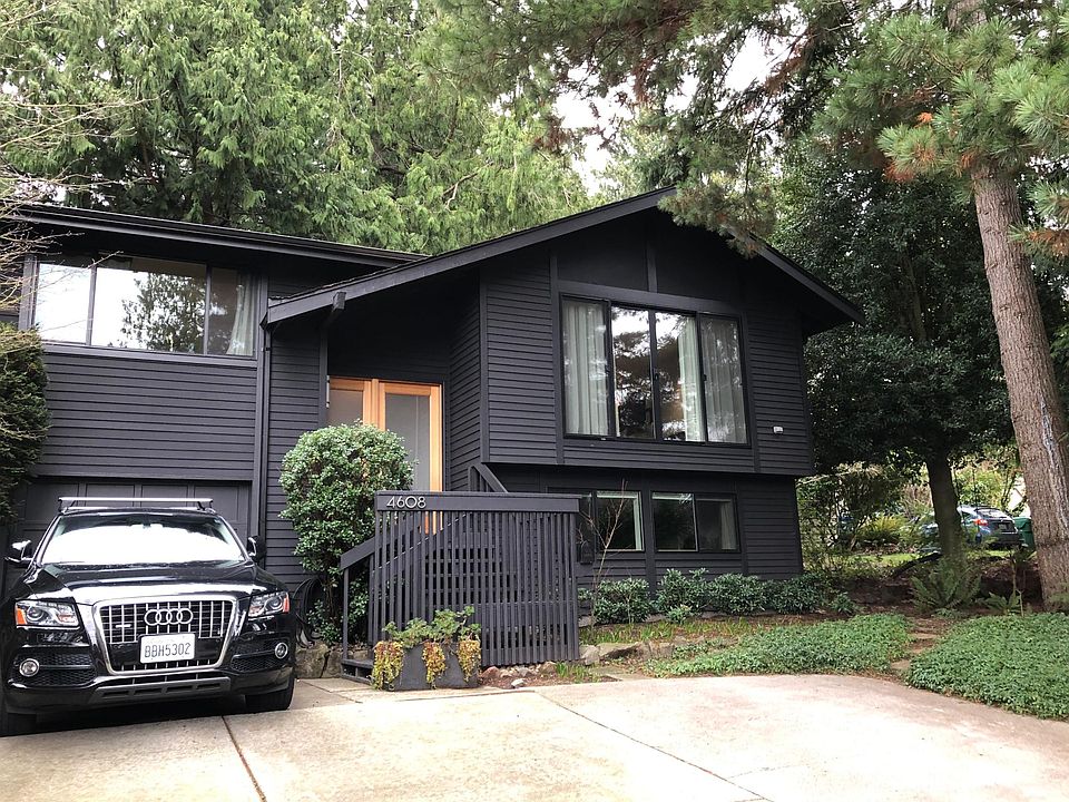Front of house with shared parking spot.