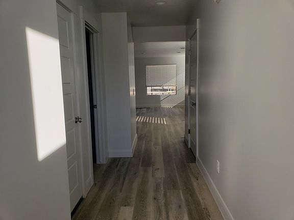 Looking down hallway into living space from front door