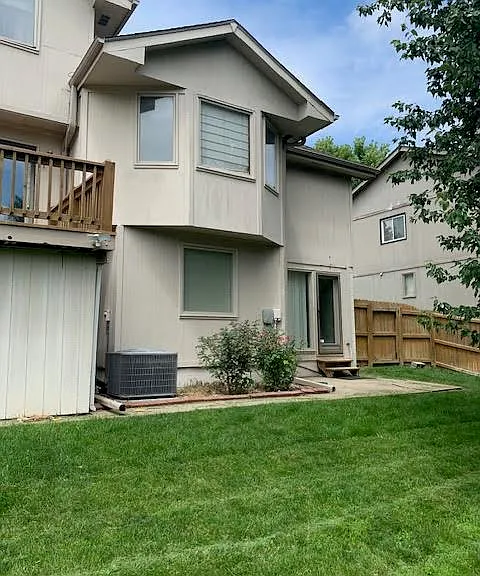 Back of Home with Fenced Yard