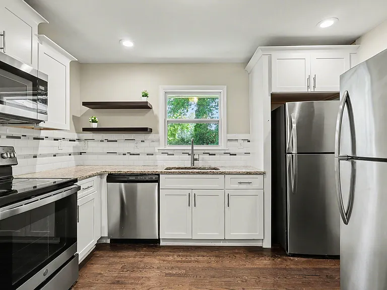 Cook, gather, and feel at home in this bright kitchen with sleek appliances and plenty of cabinet space.