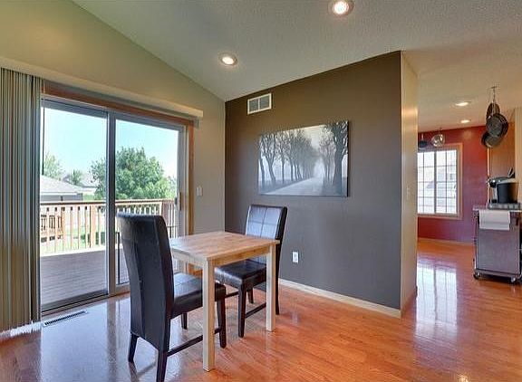 Informal dining area opens to very nice side deck.
