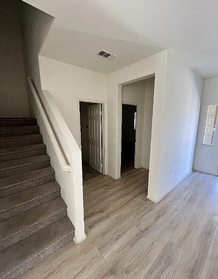 Foyer area with powder room and entry to In-Law suite downstairs