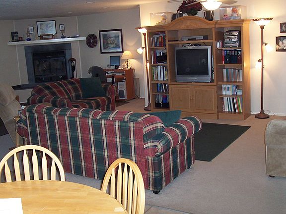 Livingroom w/ wood burning fire place.