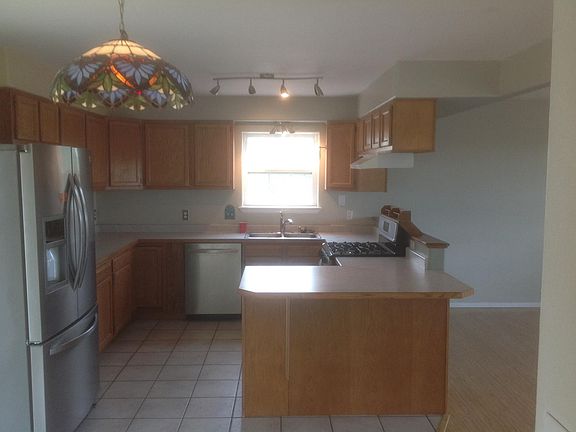 Kitchen off of dining room and living room