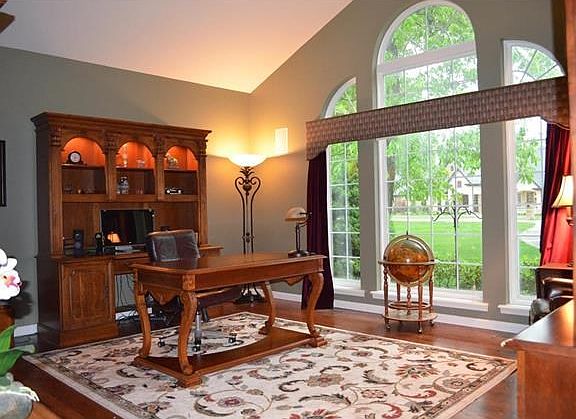 Stately Palladium window, cathedral ceiling and plenty of light for den or reading room!