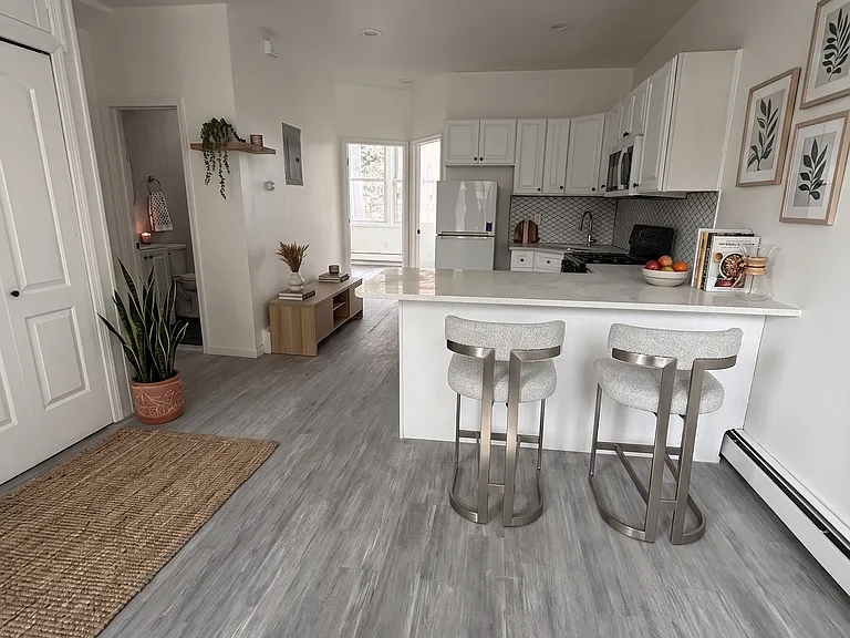 Open Concept Living & Kitchen Area- Living- This room has been virtually staged using AI to help visualize its layout and design potential.