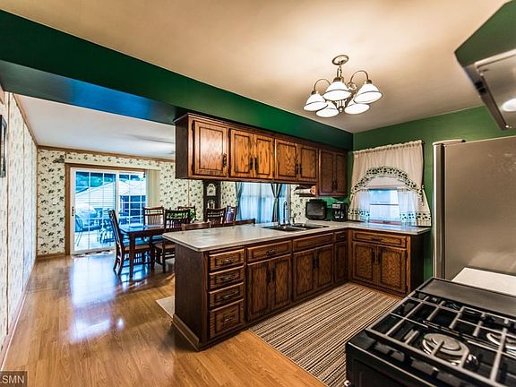 Large kitchen and dining room lead to deck.