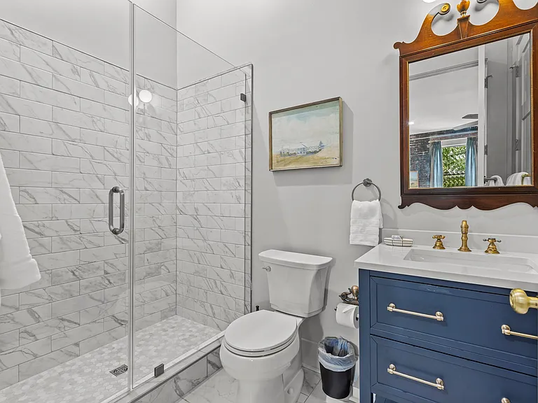 Bathroom, accessible from living space and bedroom directly.