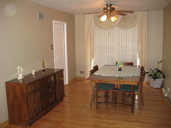 Spacious dining area with hardwood floors