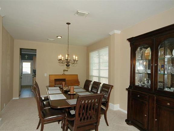 Immediately to the right of the entry way, you will see the dining room.  This room can be designed as either a formal dining and formal living area, or one huge formal dining room as seen here.