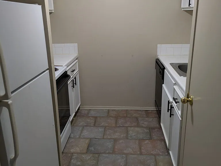 view of kitchen which contains refrigerator and stove with oven, dishwasher, and microwave oven