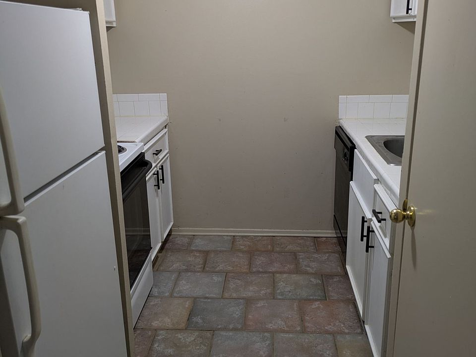 view of kitchen which contains refrigerator and stove with oven, dishwasher, and microwave oven