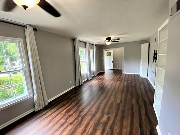 Flooring throughout the house is either tile (kitchen and baths) or this luxury vinyl plank. TV mount already in place for your flat screen TV in the large and sunny living room.