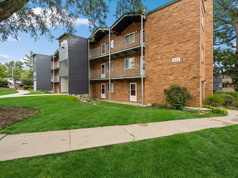 apartment building with green grass