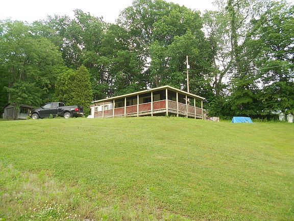Wraparound covered porch on this single wide mobile