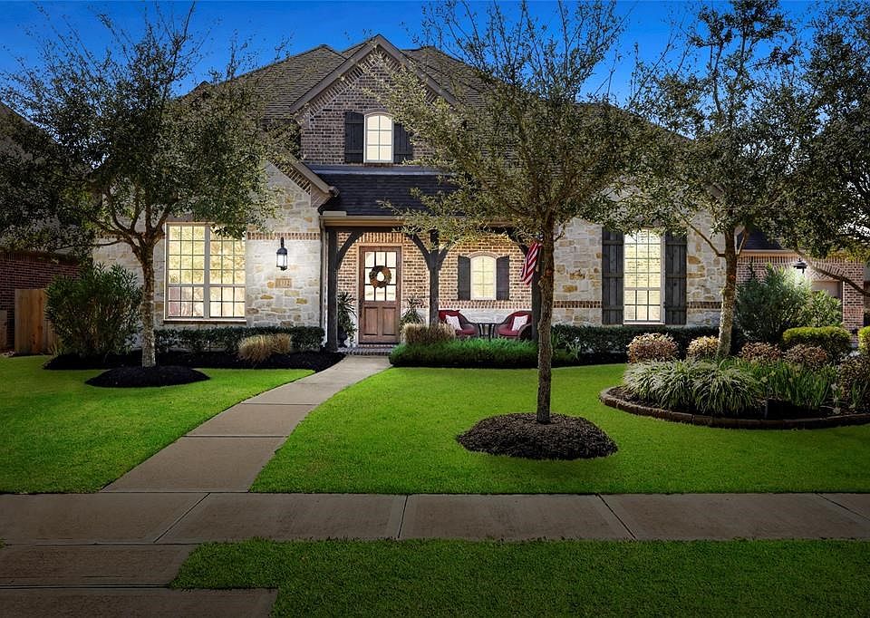 This extraordinary 2 story, 4784 sf home in the heart of  West Ranch includes 5 bedrooms, 4 full and one half baths along with an incredible interior design that MUST BE SEEN.  3 (2 + 1) car attached garages. The gorgeous front elevation is comprised of stone and brick that combines to create an unforgettable first impression.