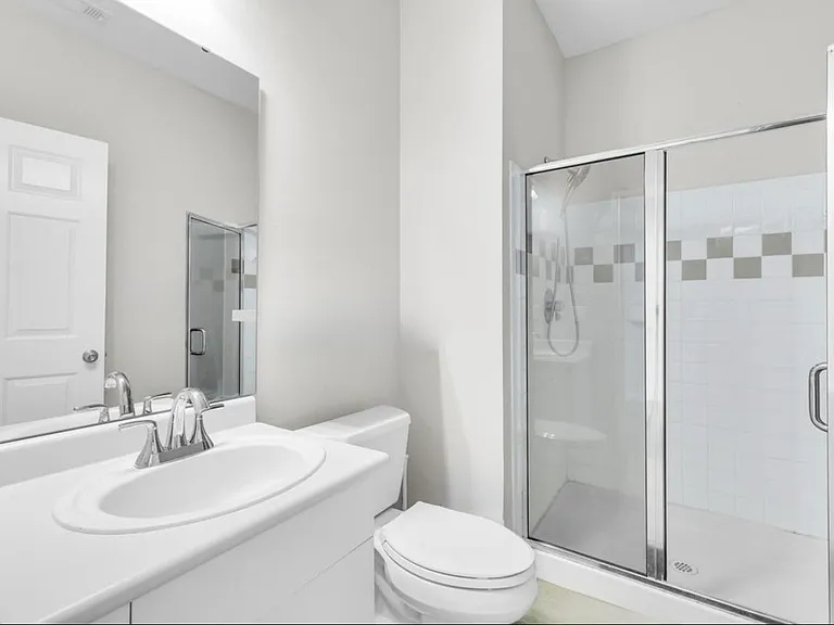 2nd floor guest bathroom. New toliet, new facuet, new lighting added in 2024.