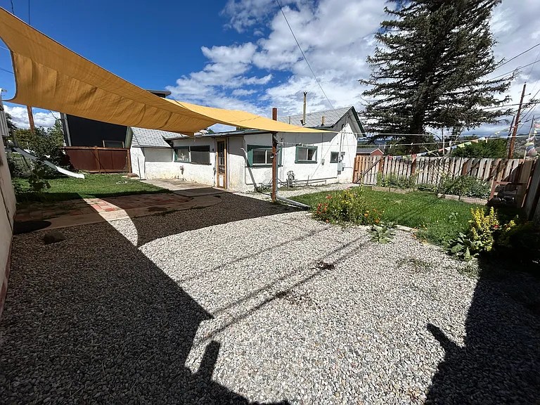 Backyard dreams activated! Gravel pad behind the fence for whatever. Two lawns, two garden beds, and endless potential for outdoor lounging or pretending to be a farmer.