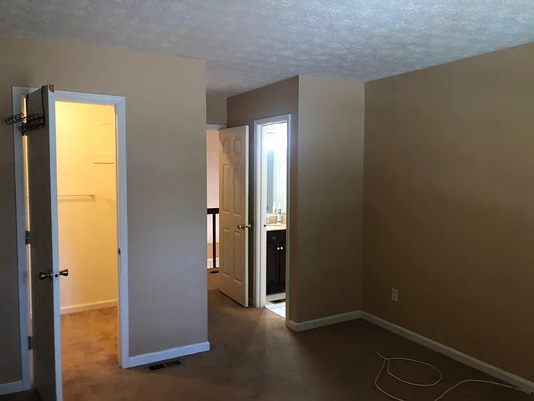Upstairs Master Bedroom - Closet to left & Master Bath to right